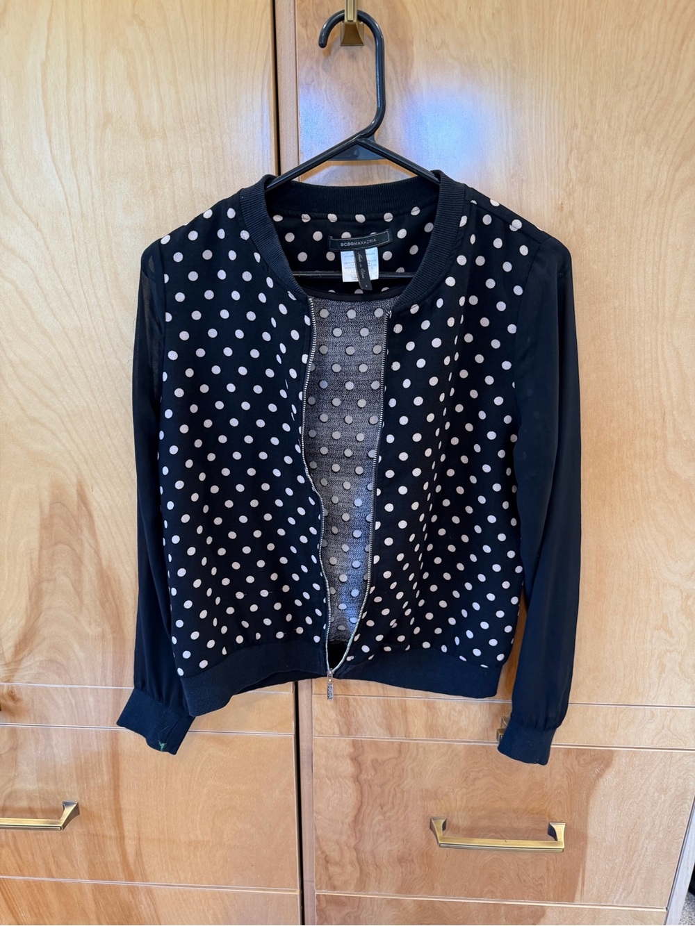 BCBGMaxAzria Black and White Polka Dot Zip Cardigan/Top with sheer long sleeves.
